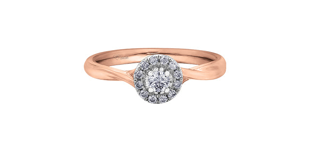 A 10K rose gold engagement ring with a halo setting, featuring a large central diamond and smaller surrounding diamonds in a band of rose gold.