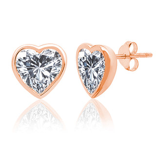 Heart-shaped diamond earrings with rose gold setting on a white background