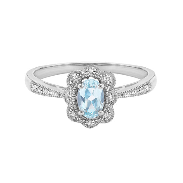 Silver ring with a blue gemstone on a white background