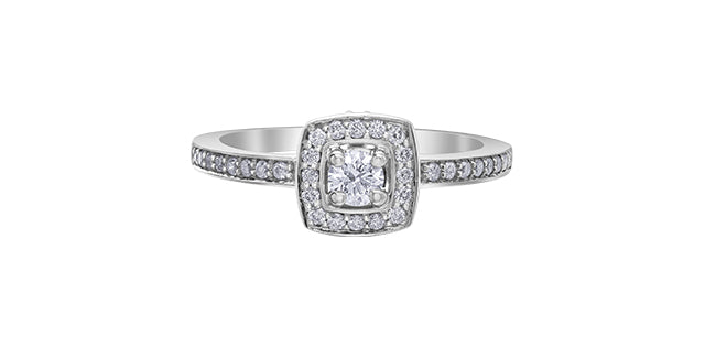 A 10K white gold engagement ring with a central Canadian diamond and smaller diamonds set in a halo design.