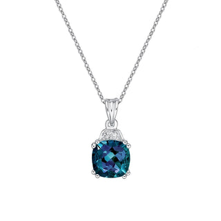 Silver necklace with a blue gemstone pendant on a white background
