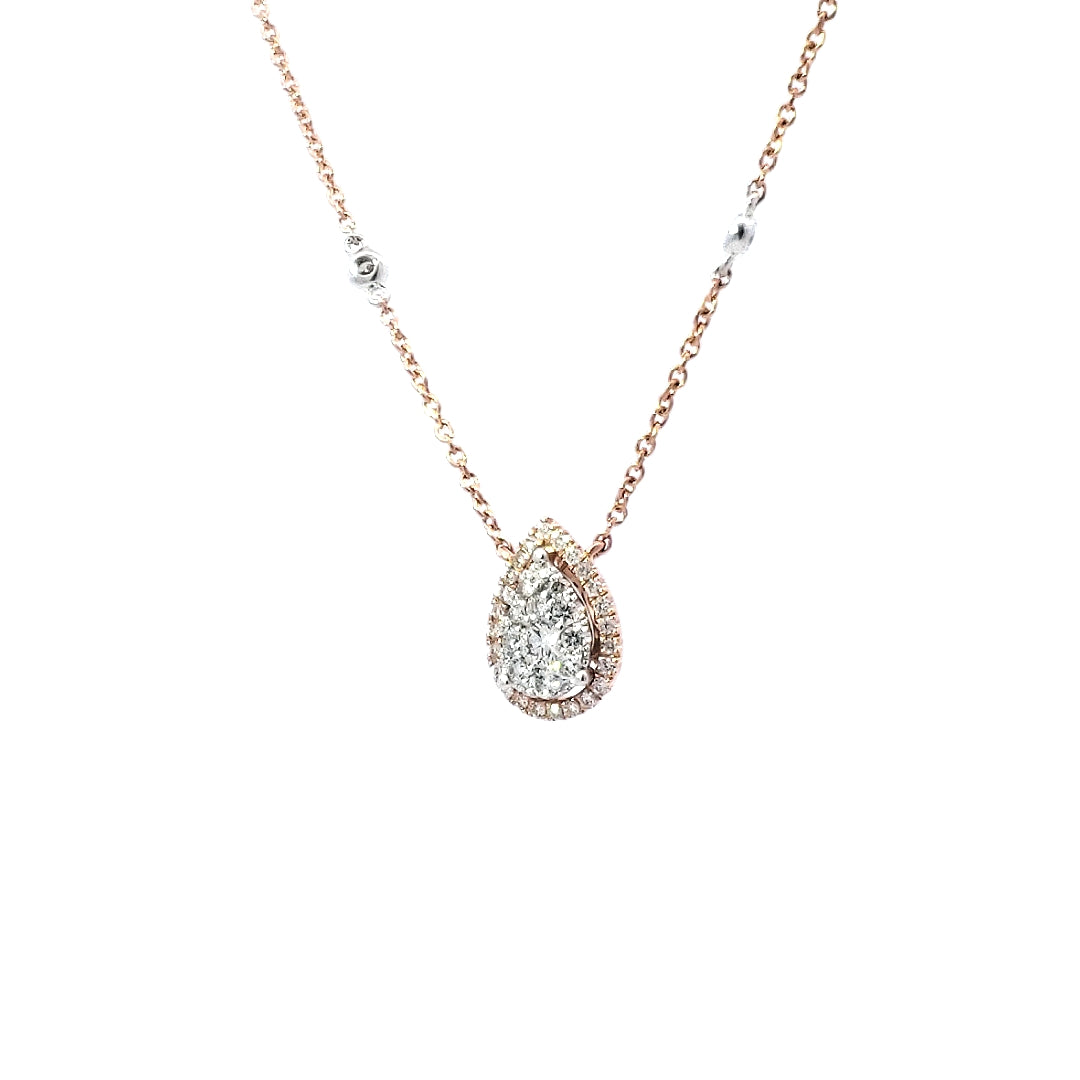 14K Rose Gold diamond pendant necklace with multiple smaller diamonds set in a circular frame, attached to a matching rose gold chain.