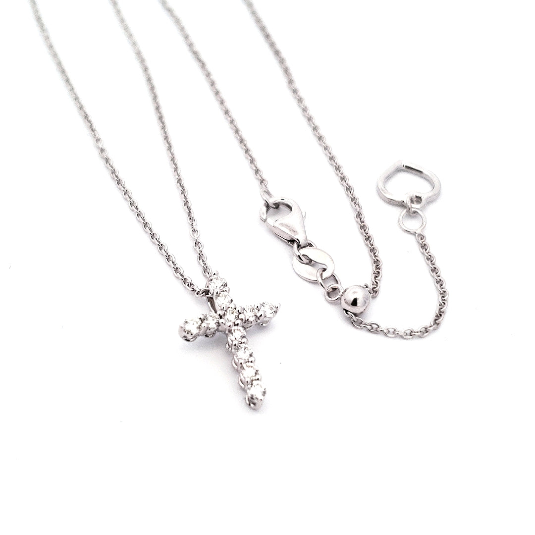 A 14K white gold diamond cross pendant necklace with a chain and lobster clasp.