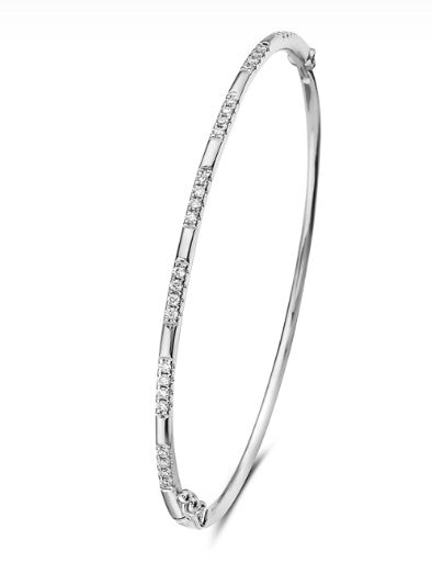 A 14K white gold diamond bangle with multiple diamonds set along the band.