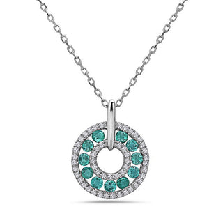 14K white gold emerald and diamond pendant necklace with a round-cut design, featuring multiple emeralds set in a circular pattern with a diamond centerpiece.