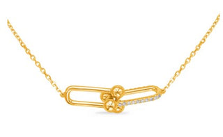 A 14K yellow gold diamond pendant necklace with a chain.