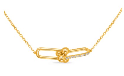 A 14K yellow gold diamond pendant necklace with a chain.