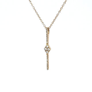 A 14K yellow gold diamond pendant necklace with a clear and visible diamond in a traditional setting.