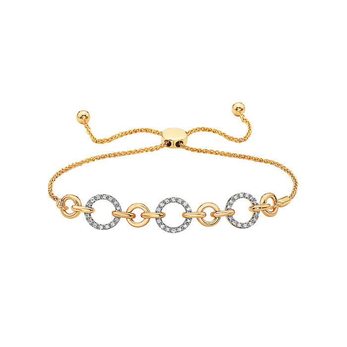A 14K yellow gold bolo bracelet with multiple chain links and a small dangling diamond ornament, featuring a clasp fastener.