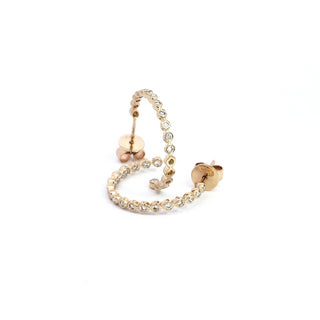 A 14K yellow gold diamond earring with a single large diamond in the center surrounded by smaller clear crystals.