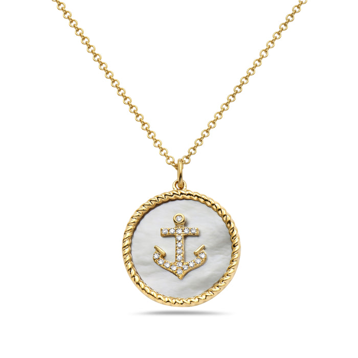 A 14K yellow gold necklace with a round white mother of pearl and a smaller round diamond, set in a gold frame with a golden chain.