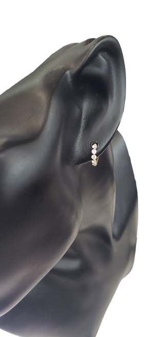 Aretes tipo argolla con diamantes de 0,49 quilates en oro amarillo de 14 quilates