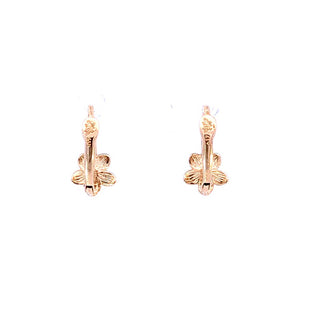 Pendientes de bebé con flor y circonita cúbica en oro amarillo de 10 quilates