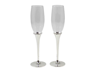 Two white champagne flutes with silver bases on a white background