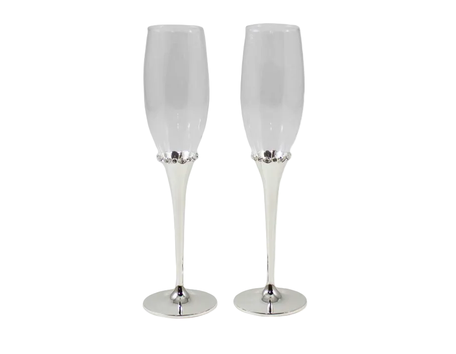 Two white champagne flutes with silver bases on a white background