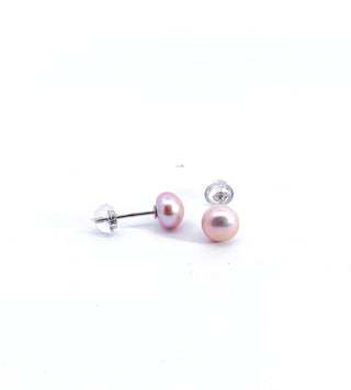 Pair of pink pearl earrings on a white background