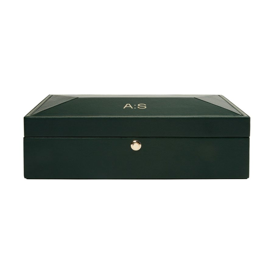 A green watch box with gold trim and the initials 'A.S' engraved on the lid, featuring a vegan leather exterior and gold hardware.