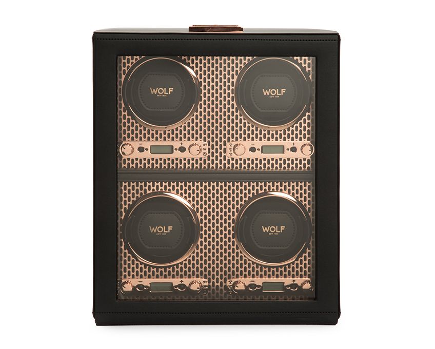 A black and rose gold 4-piece watch winder with a perforated steel design and an LCD display.