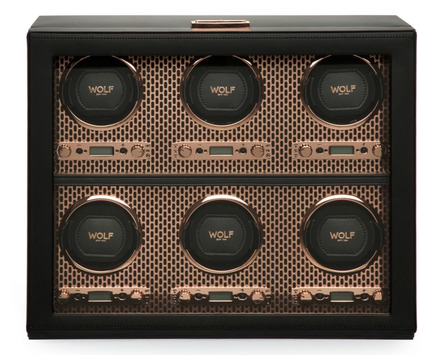 A black and rose gold 6-piece watch winder with a perforated steel design and an LCD display.