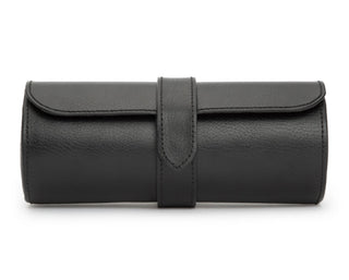 A black leather watch roll with a snap closure and a hidden jewelry capsule, designed to hold multiple watches.
