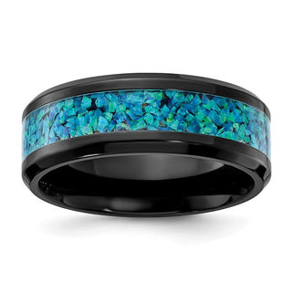 A polished band ring with blue imitation opal inlay, set in black zirconium.