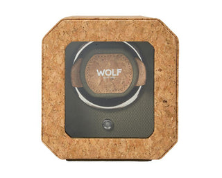 A khaki green Portuguese cork single watch winder with a hexagonal shape and a brand logo on the top.