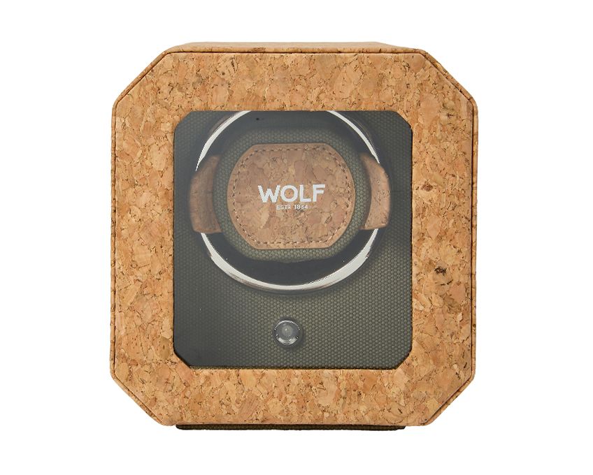 A khaki green Portuguese cork single watch winder with a hexagonal shape and a brand logo on the top.