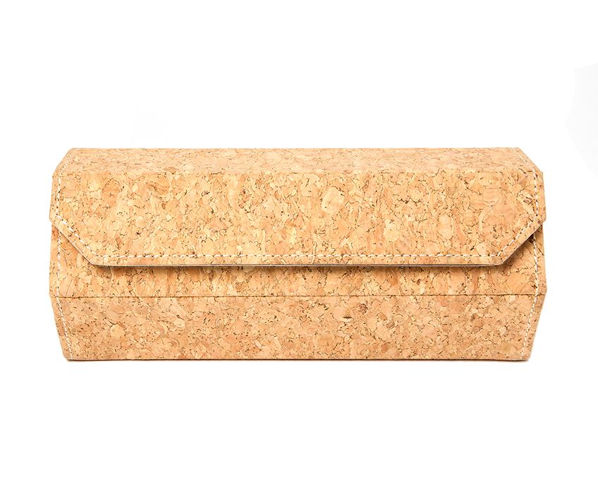 A beige-colored, hexagonal-shaped watch roll made of cork, designed to hold three watches, with a zipper closure.