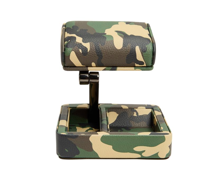 A camouflage patterned vegan leather travel watch stand with a folding mechanism, designed to secure a watch and has a tray for coins or cufflinks.