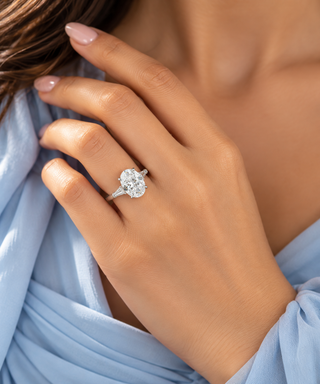 Platinum 5.5cttw Oval Lab Grown Diamond Ring with 3 stone Hidden Halo