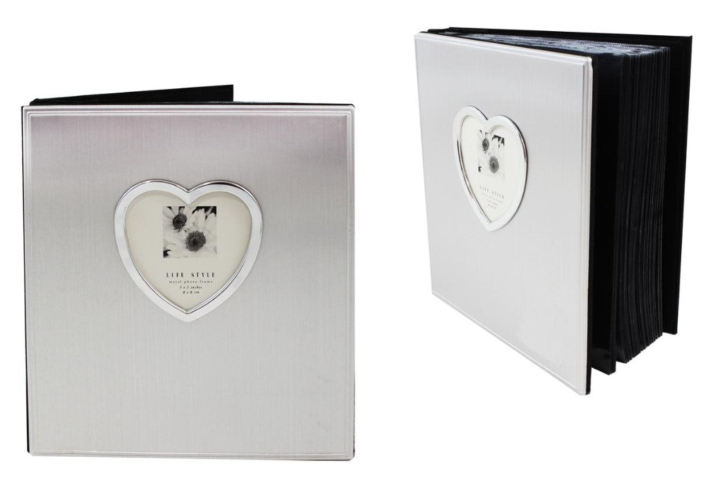 A silver aluminum picture frame with a heart-shaped design on the cover, containing an album for 4x6 photos.