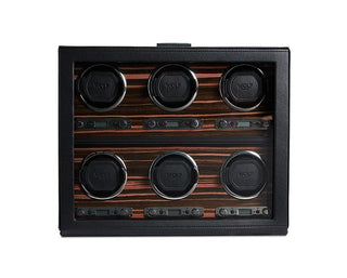 A black watch winder with a macassar polished wooden front and chrome spoked wheels.