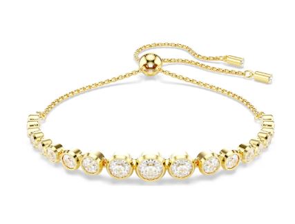 A gold-tone plated Swarovski Imber bracelet featuring a series of round-cut crystals, with a sliding closure.
