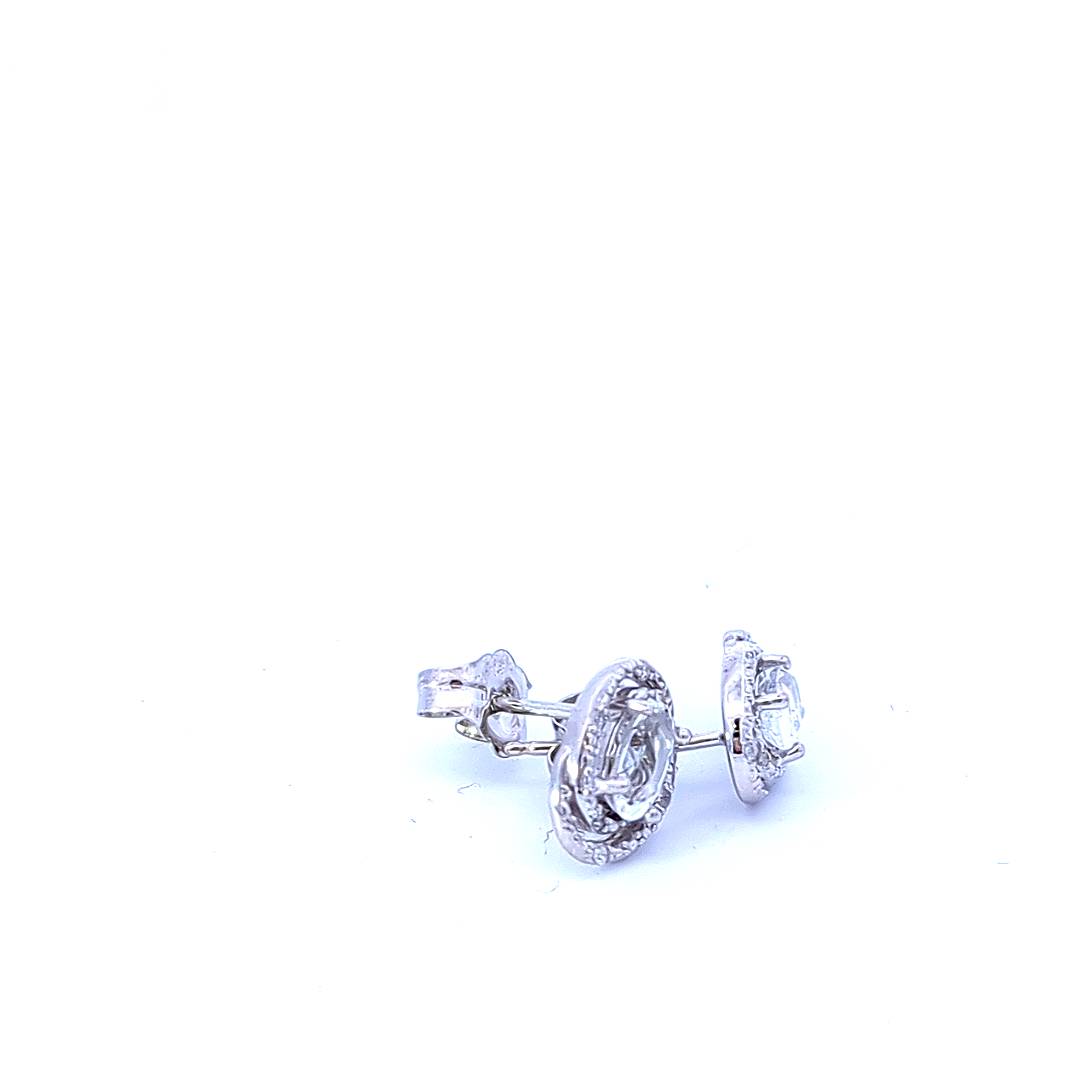 Aretes de plata de ley con topacio blanco de 0,44 quilates y halo de diamantes de 0,036 quilates