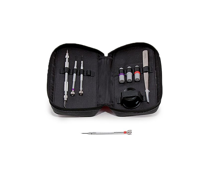 A watch repair tool kit opened to display various tools and accessories, including screwdrivers, a loupe, and tweezers, all arranged on a black faux leather surface.
