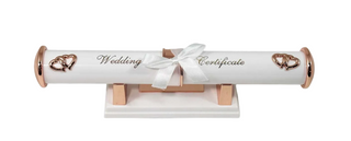 Decorative wedding certificate holder with rose gold hearts and a white ribbon on a white background