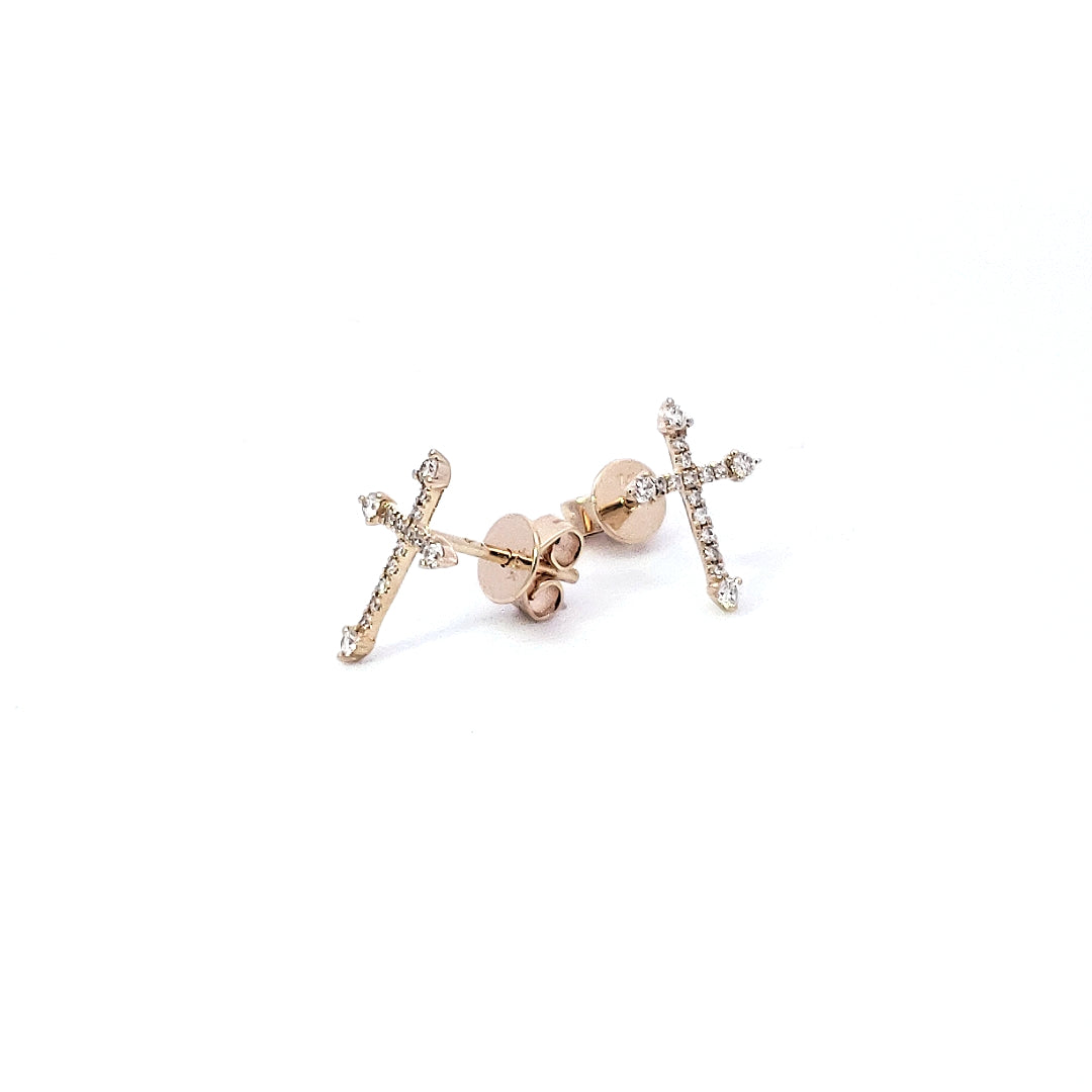 A pair of 14K yellow gold diamond cross earrings with a clear and colorless appearance.