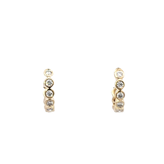 Aretes Huggie / tipo argolla con diamantes de 0,19 quilates en oro amarillo de 14 quilates