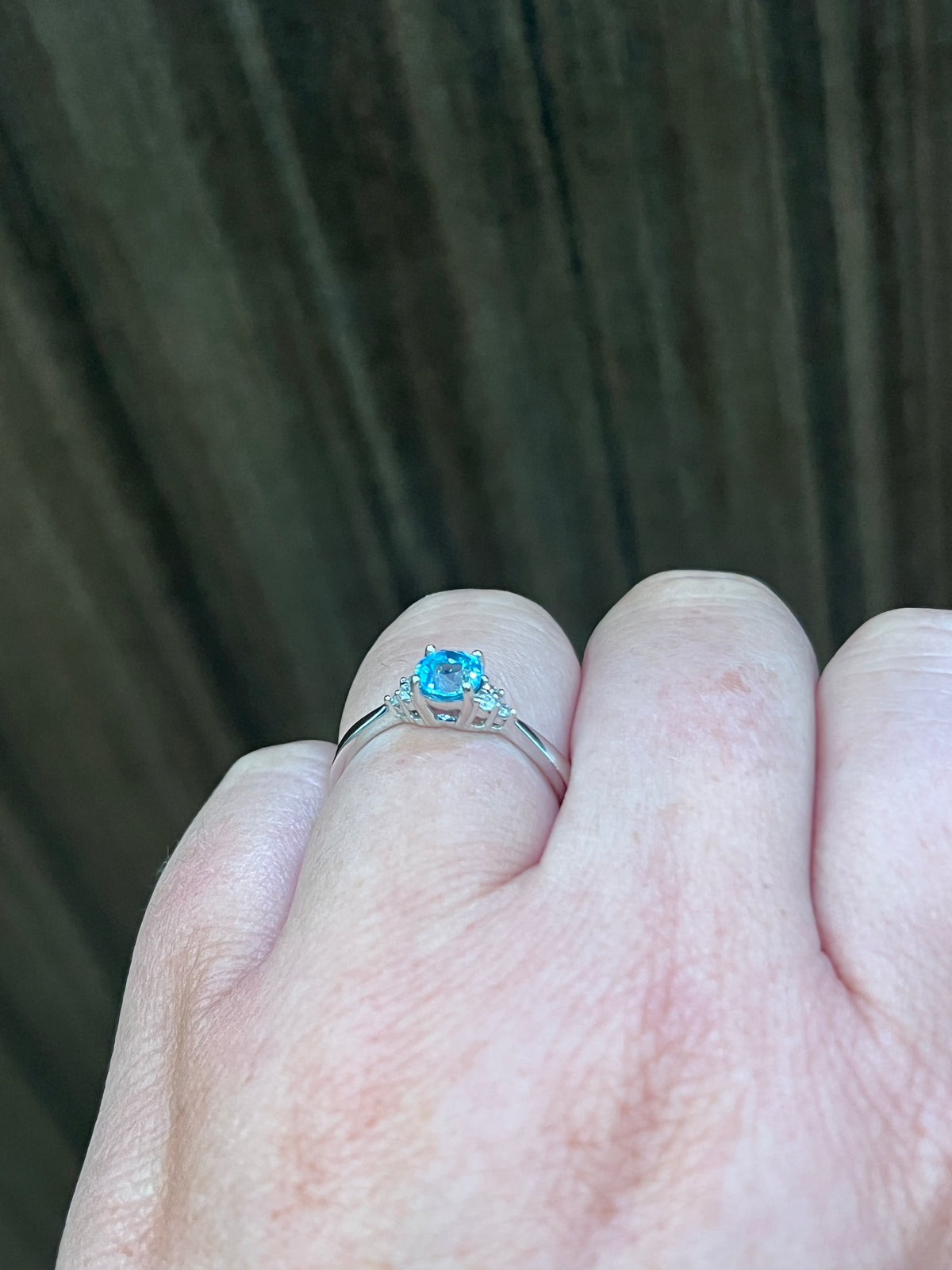 10K White Gold Blue Topaz and 0.06cttw Diamond Ring - Size 6