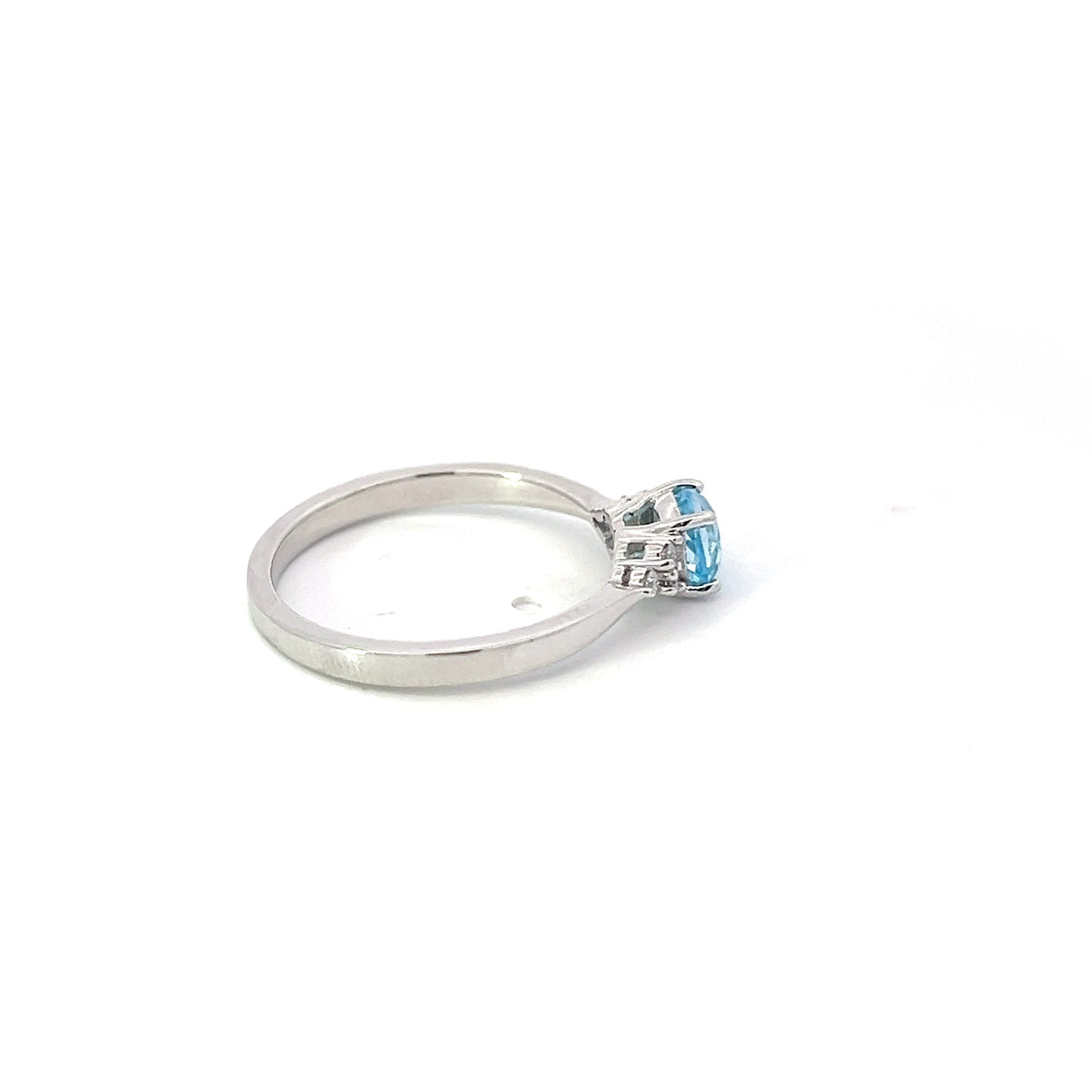 10K White Gold Blue Topaz and 0.06cttw Diamond Ring - Size 6