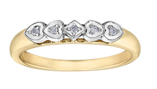 Gold and silver ring with diamond accents on a white background