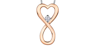 Rose gold infinity heart pendant with a diamond on a white background