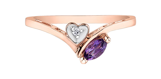 Rose gold ring with heart-shaped diamond and purple gemstone on a white background