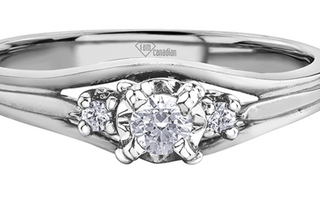 Silver ring with heart-shaped diamond and 'Lum Canadian' logo on a white background
