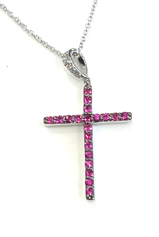 Cross-shaped pendant with pink stones on a white background