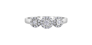 Silver ring with three circular diamond settings on a white background