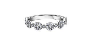 Silver ring with diamond accents on a white background