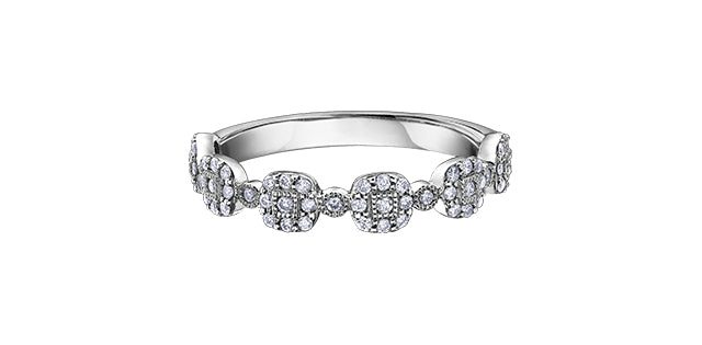 Silver ring with diamond accents on a white background