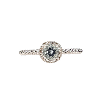 Diamond ring with a white gold band on a white background