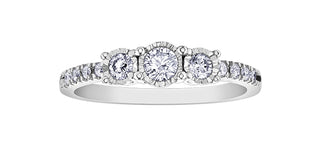 Diamond ring with multiple stones on a white background